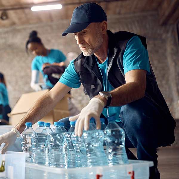A man working on the water bottle product line in a factory