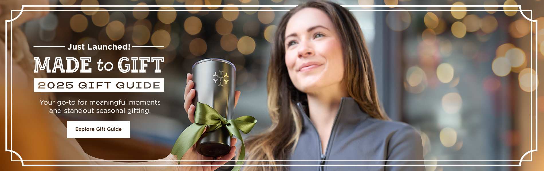Woman receiving a branded tumbler gift, promoting the 2025 Gift Guide launch