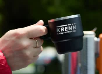 hand holding a mug