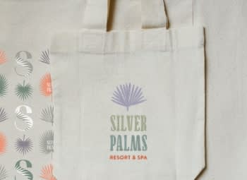 tote with silver palms decorated on it